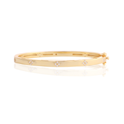 Polished CZ Clover Design Bangle in Yellow Gold