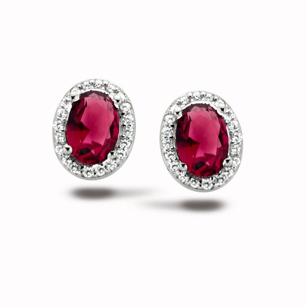 Ruby Halo Oval Studs in White Gold